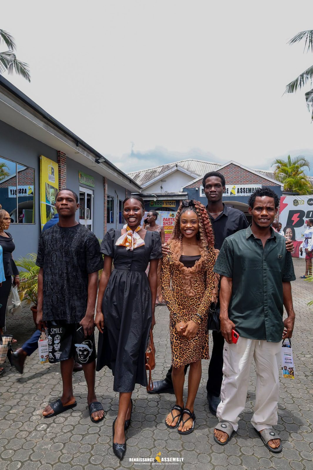 A group of listeners gathered together, smiling